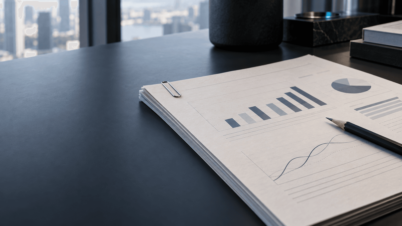Art-directed printed revenue report with charts on a desk